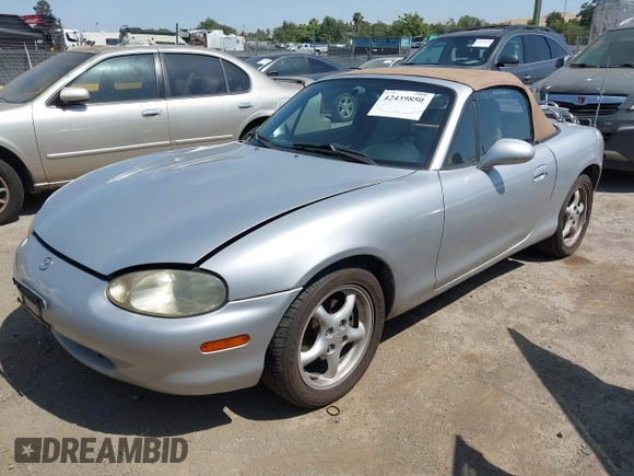 1999 Mazda MX-5 Miata with VIN JM1NB3539X0131393, listed as a IAAI auction lot 42439850 with 210,710 mi miles and . Bid and sale history available at DreamBid. Image 2.