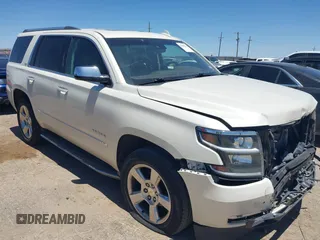 2015 Chevrolet Tahoe LTZ z VIN 1GNSKCKC7FR736148, wystawiony jako IAAI lot #42299311 z przebiegiem 135 359 mil mil oraz . Historia ofert i sprzedaży dostępna na DreamBid. Obrazek 1.