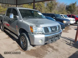2004 Nissan Titan LE with VIN 1N6AA07BX4N537229, listed as a IAAI auction lot 41234790 with 210,475 mi miles. Bid and sale history available at carsss.com. Image 1.