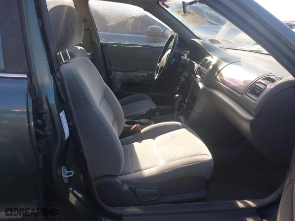 1998 Mazda 626 DX with VIN 1YVGF22C4W5768778, listed as a IAAI auction lot 41971066 with 119,168 mi miles. Bid and sale history available at carsss.com. Image 5.