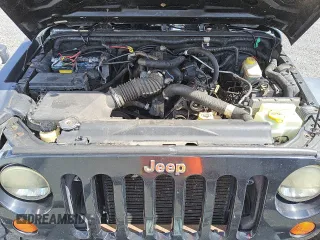 2007 Jeep Wrangler Unlimited X with VIN 1J4GA391X7L145896, listed as a Copart auction lot 45404625 with 152,278 mi miles and Clean title. Bid and sale history available at DreamBid. Image 12.