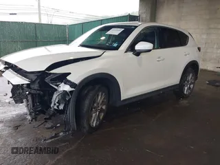 2019 Mazda CX-5 Grand Touring with VIN JM3KFBDMXK0648813, listed as a IAAI auction lot 42524680 with 23,521 mi miles and . Bid and sale history available at DreamBid. Image 18.