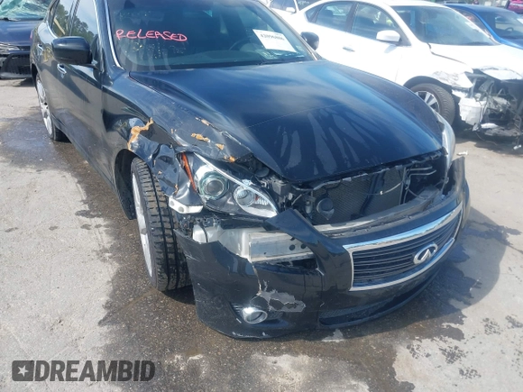 2013 Infiniti M with VIN JN1AY1AR6DM590187, listed as a IAAI auction lot 42096806 with 182,909 mi miles and . Bid and sale history available at DreamBid. Image 6.