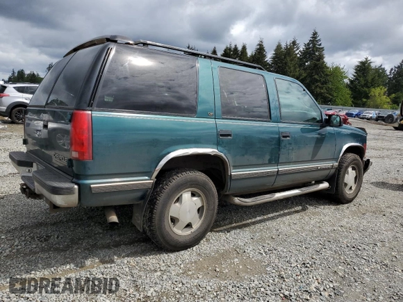 1998 Chevrolet Tahoe z VIN 1GNEK13R2WJ304666, wystawiony jako Copart lot #57833815 z przebiegiem 199 103 mil mil oraz Szkoda całkowita • Salvage title. Historia ofert i sprzedaży dostępna na DreamBid. Obrazek 3.