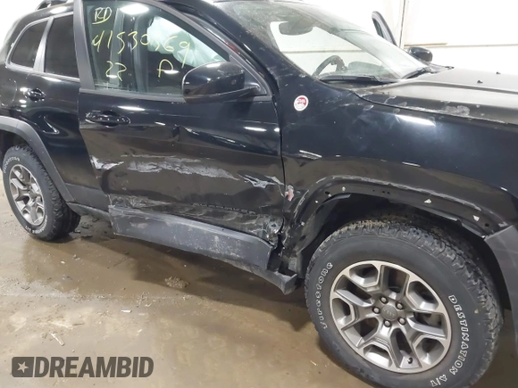 2022 Jeep Cherokee Trailhawk with VIN 1C4PJMBX8ND517236, listed as a IAAI auction lot 41530369 with 34,164 mi miles and . Bid and sale history available at DreamBid. Image 6.