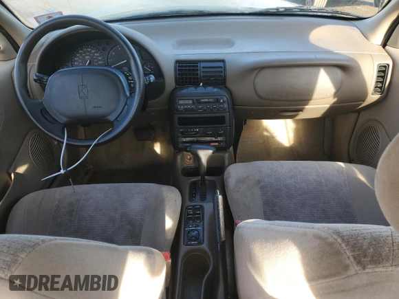 1999 Saturn SL z VIN 1G8ZK5270XZ212874, wystawiony jako Copart lot #85317464 z przebiegiem 153 477 mil mil oraz Szkoda całkowita • Salvage title. Historia ofert i sprzedaży dostępna na DreamBid. Obrazek 8.