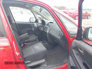 2009 Suzuki SX4 Sport FWD with VIN JS2YC414596200021, listed as a IAAI auction lot 40753192 with 144,805 mi miles and . Bid and sale history available at DreamBid. Image 5.