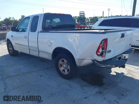 2002 Ford F-150 XL with VIN 1FTRX17WX2NA92467, listed as a IAAI auction lot 41977334 with 176,902 mi miles. Bid and sale history available at carsss.com. Image 3.