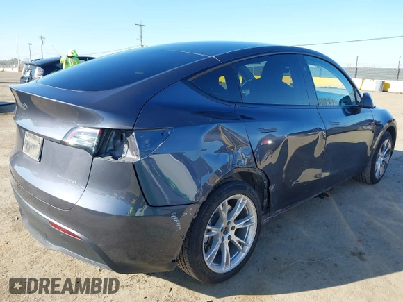 2023 Tesla Model Y Long Range with VIN 7SAYGAEE5PF964083, listed as a IAAI auction lot 41365919 with 26,008 mi miles and . Bid and sale history available at carsss.com. Image 4.
