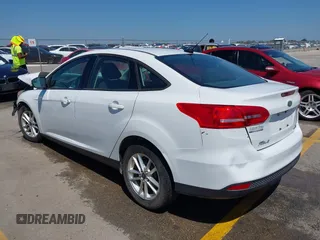 2016 Ford Focus SE z VIN 1FADP3F23GL338496, wystawiony jako IAAI lot #42333608 z przebiegiem 76 972 mil mil oraz . Historia ofert i sprzedaży dostępna na DreamBid. Obrazek 3.