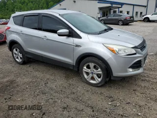 2014 Ford Escape SE with VIN 1FMCU9GX8EUC48467, listed as a Copart auction lot 57269155 with 148,611 mi miles and Salvage title. Bid and sale history available at DreamBid. Image 4.