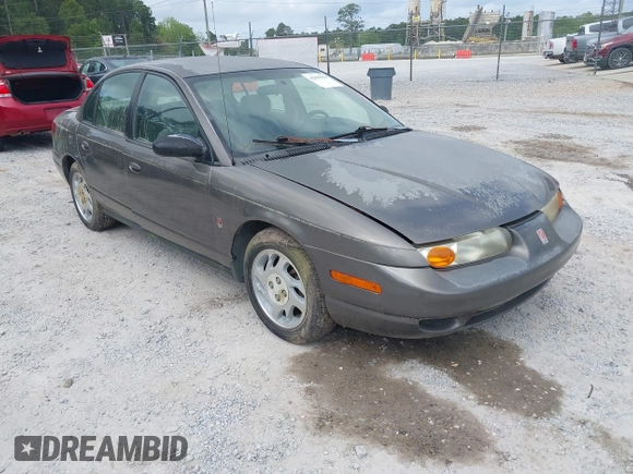 2000 Saturn SL z VIN 1G8ZK527XYZ121984, wystawiony jako IAAI lot #42099839 z przebiegiem 174 210 mil mil oraz . Historia ofert i sprzedaży dostępna na DreamBid. Obrazek 1.