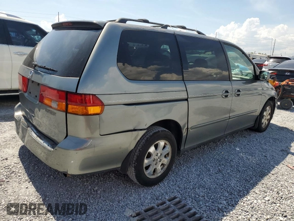 2002 Honda Odyssey EX-L with VIN 2HKRL18962H552809, listed as a Copart auction lot 63631115 with 224,019 mi miles and Salvage title. Bid and sale history available at DreamBid. Image 3.