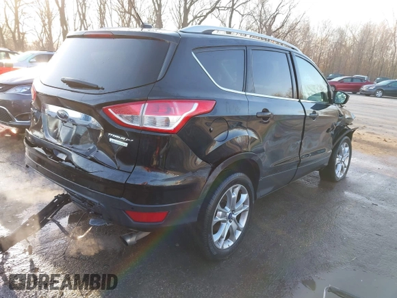 2014 Ford Escape Titanium with VIN 1FMCU0JX0EUC21512, listed as a IAAI auction lot 41781026 with 142,771 mi miles. Bid and sale history available at carsss.com. Image 4.
