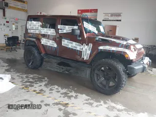 2008 Jeep Wrangler Unlimited Rubicon z VIN 1J4GA69188L626040, wystawiony jako IAAI lot #42285491 z przebiegiem 149 634 mil mil oraz . Historia ofert i sprzedaży dostępna na DreamBid. Obrazek 1.