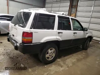 1995 Jeep Grand Cherokee Laredo with VIN 1J4GZ58S6SC630947, listed as a Copart auction lot 82143564 with 267,946 mi miles and Salvage Title. Bid and sale history available at carsss.com. Image 3.