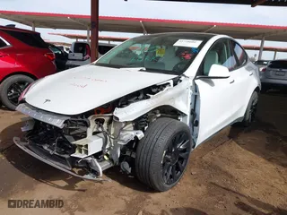 2023 Tesla Model Y Long Range with VIN 7SAYGDEEXPF691580, listed as a IAAI auction lot 41728604 with 19,601 mi miles. Bid and sale history available at carsss.com. Image 18.