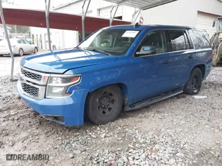 2015 Chevrolet Tahoe Commercial with VIN 1GNSK2EC1FR663199, listed as a IAAI auction lot 41552787 with 148,187 mi miles. Bid and sale history available at carsss.com. Image 2.