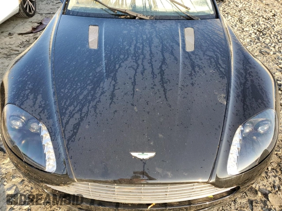 2008 Aston Martin Vantage z VIN SCFBF04B18GD08076, wystawiony jako Copart lot #70620153 z przebiegiem Nie podano mil oraz . Historia ofert i sprzedaży dostępna na DreamBid. Obrazek 11.