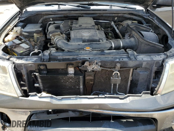 2008 Nissan Frontier SE with VIN 1N6AD07UX8C406795, listed as a Copart auction lot 61303185 with 145,742 mi miles and Salvage title. Bid and sale history available at DreamBid. Image 11.