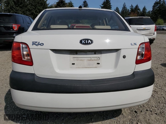 2009 Kia Rio LX with VIN KNADE223896456292, listed as a Copart auction lot 54990605 with 61,220 mi miles and Salvage Title. Bid and sale history available at DreamBid. Image 6.