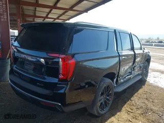 2024 GMC Yukon XL SLT with VIN 1GKS2GKD2RR157523, listed as a IAAI auction lot 41600219 with 52,444 mi miles. Bid and sale history available at carsss.com. Image 4.