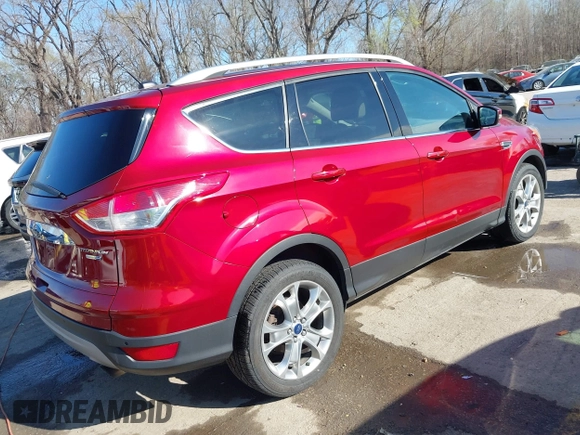 2014 Ford Escape Titanium with VIN 1FMCU9J97EUB79748, listed as a IAAI auction lot 41884915 with 197,899 mi miles. Bid and sale history available at carsss.com. Image 4.