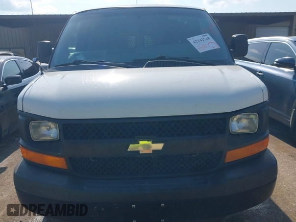 2014 Chevrolet Express Cargo Van with VIN 1GCWGFCG0E1100859, listed as a IAAI auction lot 42142748 with 182,900 mi miles. Bid and sale history available at carsss.com. Image 6.