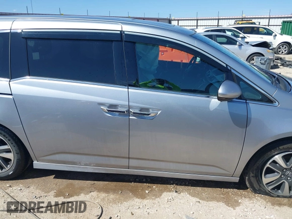 2016 Honda Odyssey Touring Elite with VIN 5FNRL5H96GB090653, listed as a IAAI auction lot 41720195 with 68,969 mi miles. Bid and sale history available at carsss.com. Image 13.