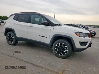 2020 Jeep Compass Trailhawk with VIN 3C4NJDDB3LT189398, listed as a Copart auction lot 59376995 with 75,674 mi miles and Salvage title. Bid and sale history available at DreamBid. Image 4.