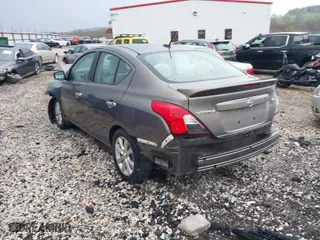 2017 Nissan Versa Sedan SV with VIN 3N1CN7AP5HL858214, listed as a IAAI auction lot 41943167 with 131,546 mi miles. Bid and sale history available at carsss.com. Image 3.