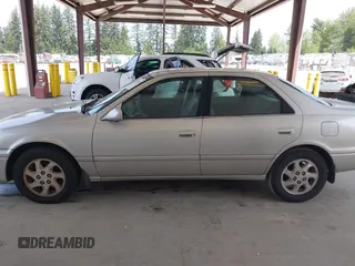 2000 Toyota Camry LE z VIN JT2BF22K2Y0239961, wystawiony jako IAAI lot #42128226 z przebiegiem 154 691 mil mil oraz . Historia ofert i sprzedaży dostępna na DreamBid. Obrazek 14.