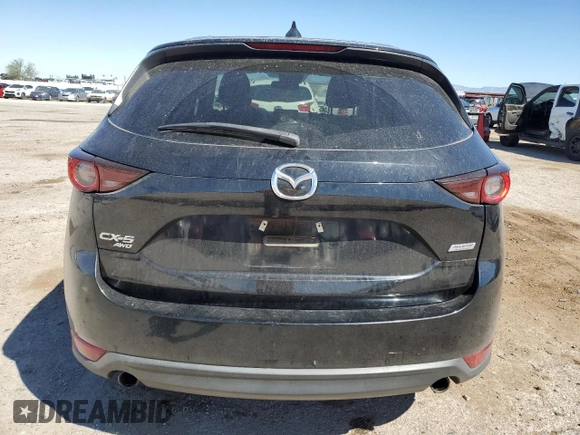 2017 Mazda CX-5 Touring z VIN JM3KFBCL4H0184922, wystawiony jako Copart lot #50166195 z przebiegiem 86 270 mil mil oraz Szkoda całkowita • Salvage title. Historia ofert i sprzedaży dostępna na DreamBid. Obrazek 6.