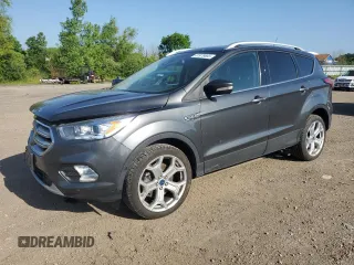 2019 Ford Escape Titanium with VIN 1FMCU0J96KUB22884, listed as a Copart auction lot 61979665 with 63,824 mi miles and Salvage title. Bid and sale history available at DreamBid. Image 1.