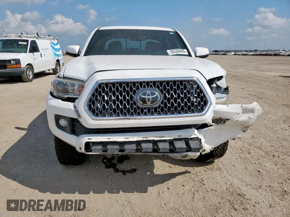 2018 Toyota Tacoma SR z VIN 3TMCZ5AN0JM178886, wystawiony jako Copart lot #56330495 z przebiegiem 71 962 mil mil oraz Szkoda całkowita • Salvage title. Historia ofert i sprzedaży dostępna na DreamBid. Obrazek 5.