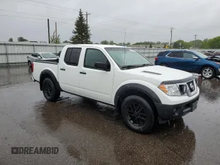 2018 Nissan Frontier SV with VIN 1N6AD0EV5JN744725, listed as a Copart auction lot 57601215 with 61,718 mi miles and Salvage title. Bid and sale history available at DreamBid. Image 4.
