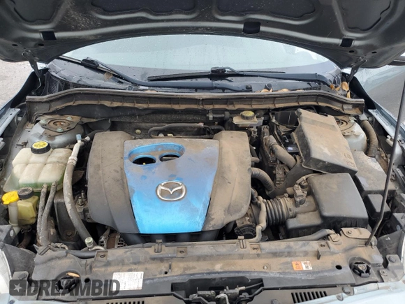 2012 Mazda 3 i Touring z VIN JM1BL1V74C1554961, wystawiony jako Copart lot #55955615 z przebiegiem 146 764 mil mil oraz Szkoda całkowita • Salvage title. Historia ofert i sprzedaży dostępna na DreamBid. Obrazek 11.