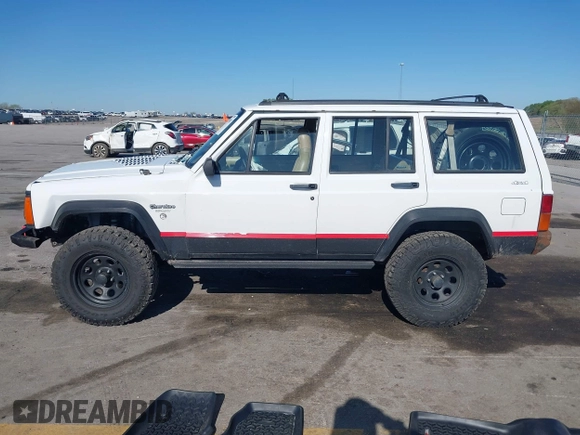 1995 Jeep Cherokee Sport with VIN 1J4FJ68S1SL576255, listed as a IAAI auction lot 42178902 with 214,041 mi miles and . Bid and sale history available at DreamBid. Image 14.