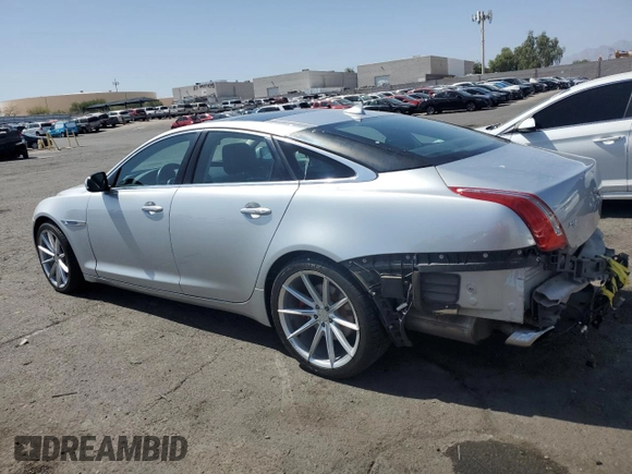 2015 Jaguar XJ with VIN SAJWJ1CD4F8V82496, listed as a Copart auction lot 71013474 with 52,744 mi miles and Salvage title. Bid and sale history available at DreamBid. Image 2.