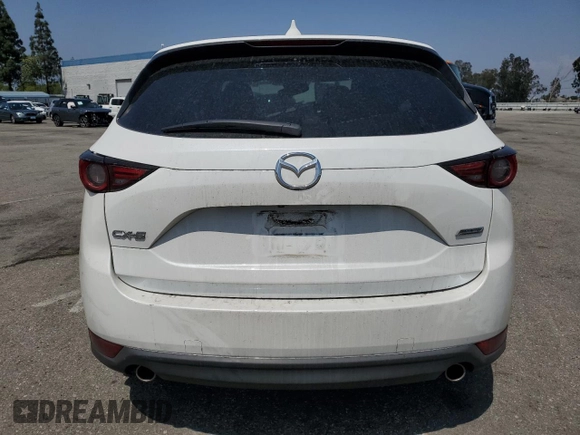 2018 Mazda CX-5 Grand Touring z VIN JM3KFADM3J1464073, wystawiony jako Copart lot #59571385 z przebiegiem Nie podano mil oraz Szkoda całkowita • Salvage title. Historia ofert i sprzedaży dostępna na DreamBid. Obrazek 6.