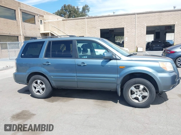 2007 Honda Pilot EX with VIN 2HKYF18447H520522, listed as a IAAI auction lot 42018937 with 128,401 mi miles. Bid and sale history available at carsss.com. Image 13.