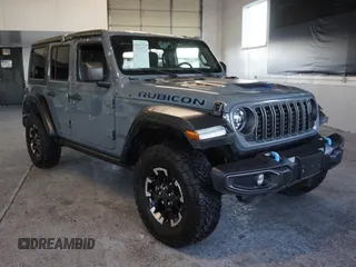 2024 Jeep Wrangler Rubicon z VIN 1C4RJXR62RW292085, wystawiony jako Copart lot #56419895 z przebiegiem 16 097 mil mil oraz Czysty tytuł • Clean title. Historia ofert i sprzedaży dostępna na DreamBid. Obrazek 1.