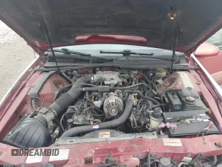 1996 Ford Thunderbird LX with VIN 1FALP62W7TH135632, listed as a Copart auction lot 77134024 with 128,931 mi miles and Salvage Title. Bid and sale history available at DreamBid. Image 12.