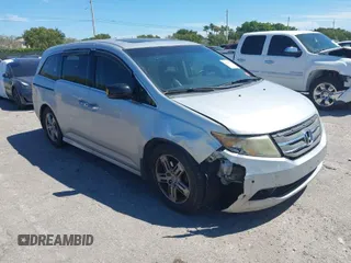 2012 Honda Odyssey Touring with VIN 5FNRL5H90CB099519, listed as a IAAI auction lot 41854550 with 185,110 mi miles. Bid and sale history available at carsss.com. Image 1.