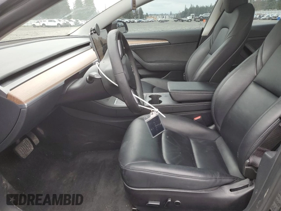 2023 Tesla Model 3 Long Range with VIN 5YJ3E1EB9PF607217, listed as a Copart auction lot 50103645 with 82,198 mi miles and Salvage Title. Bid and sale history available at DreamBid. Image 7.
