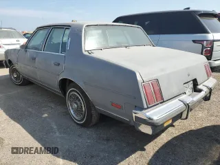 1987 Oldsmobile Cutlass z VIN 2G3GM51Y1H2347545, wystawiony jako Copart lot #76087594 z przebiegiem 98 257 mil mil oraz Szkody całkowita. Historia ofert i sprzedaży dostępna na DreamBid. Obrazek 2.