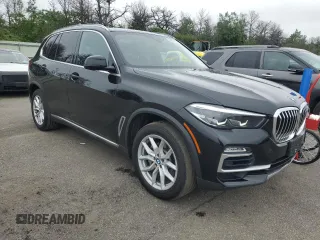2020 BMW X5 xDrive40i with VIN 5UXCR6C09L9C95232, listed as a Copart auction lot 60697765 with 30,017 mi miles and Salvage title. Bid and sale history available at DreamBid. Image 4.