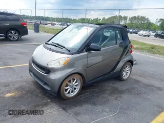 2009 Smart fortwo Passion with VIN WMEEK31XX9K299061, listed as a IAAI auction lot 42190127 with 96,156 mi miles. Bid and sale history available at carsss.com. Image 2.