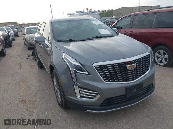 2021 Cadillac XT5 FWD Premium Luxury with VIN 1GYKNCRS5MZ128908, listed as a IAAI auction lot 41919571 with 51,280 mi miles and . Bid and sale history available at carsss.com. Image 1.