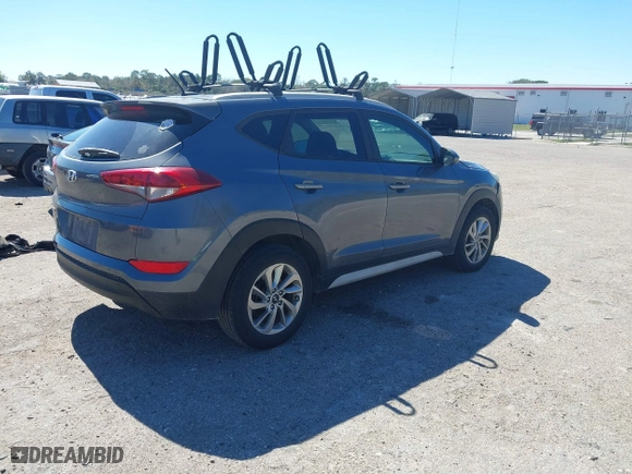 2017 Hyundai Tucson SE Plus with VIN KM8J33A45HU452928, listed as a IAAI auction lot 41601229 with 114,949 mi miles. Bid and sale history available at carsss.com. Image 4.
